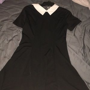 black dress with white collar about knee length